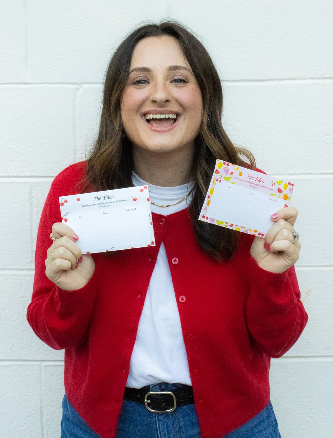 Hanna holding two Eden sticky-note pads